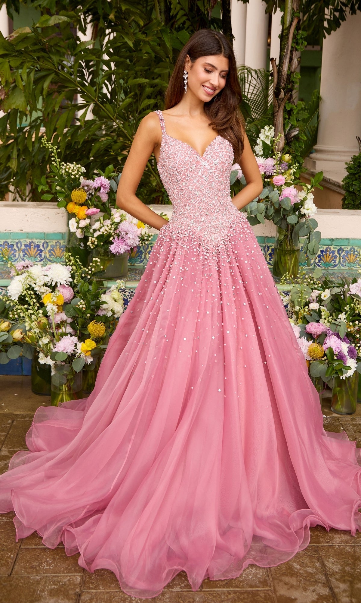 The Ava Presley 42643 is a pink, floor-length ball gown featuring a beaded, sweetheart-neckline bodice and a full tulle skirt.